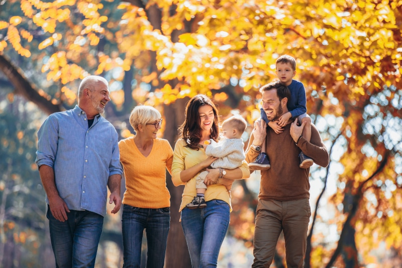 Grandparents enjoying time with grandchildren, representing family security and the peace of mind from estate planning