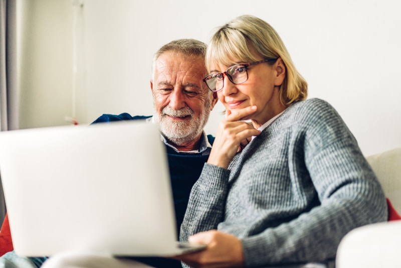 A couple reviewing important documents together at home, discussing their Will and future plans