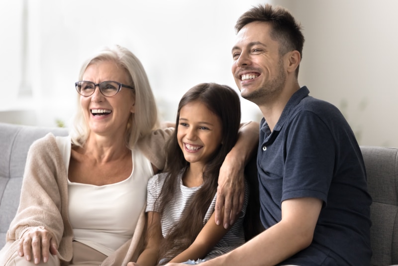 A multi-generational family together, representing the importance of planning ahead with a Power of Attorney